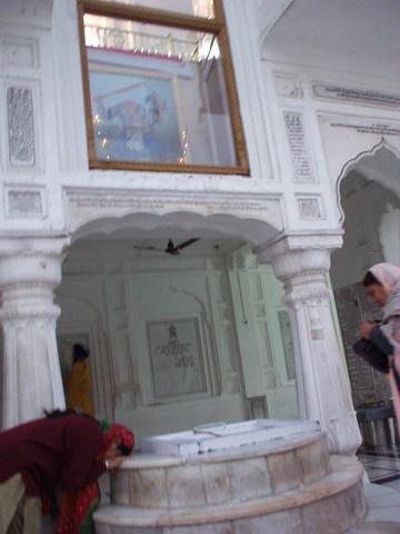 Woman paying homage to Guru Deep Singh.
