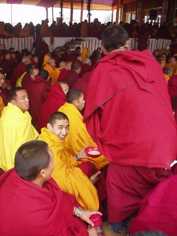 Happy monk, with tea, at the 2003 Kalachakra Initiation, Bodhgaya.