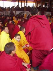 Happy monk, with tea, at the 2003 Kalachakra Initiation, Bodhgaya.
