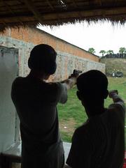 Firing a Colt .45, Phenom Penh.
