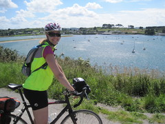 Riding by boats floating on the high tide in Dourduff, Bretagne, France.