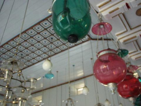 Colored lights hanging from the ceiling of the Mattancherry Synagogue, Kerala.