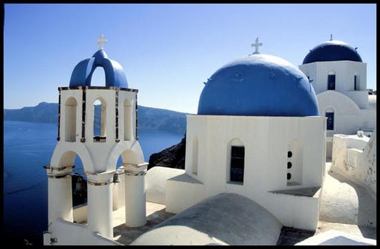 One of the many blue domed churches of Santorini.