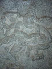 Vishnu, as Narasimha, gobbling the evil king Hiranyakashipu's entrails.
