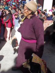 Man holding a dog that was (involuntarily) participating in the 2003 Spituk Festival.