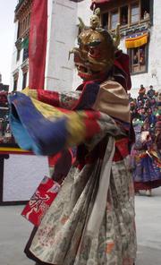 Dancing masked monk at the Spituk Festival, 2003.