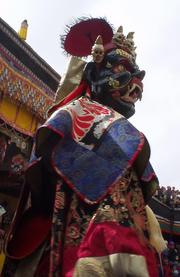 Dancing masked monk at the Spituk Festival, 2003.