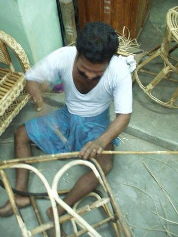 Man making wicker chairs, Madurai.