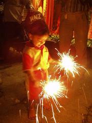 Boy with sparklers for Diwali.