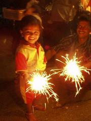 Boy with sparklers for Diwali.