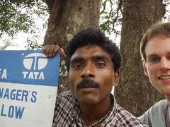Rajan and Joe by the Assistant Manager's bungalow sign.